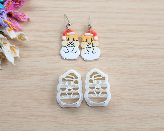 Christmas Hamster Polymer Clay Cutter shaped like a hamster wearing a Santa hat, designed for making polymer clay ornaments and crafts.