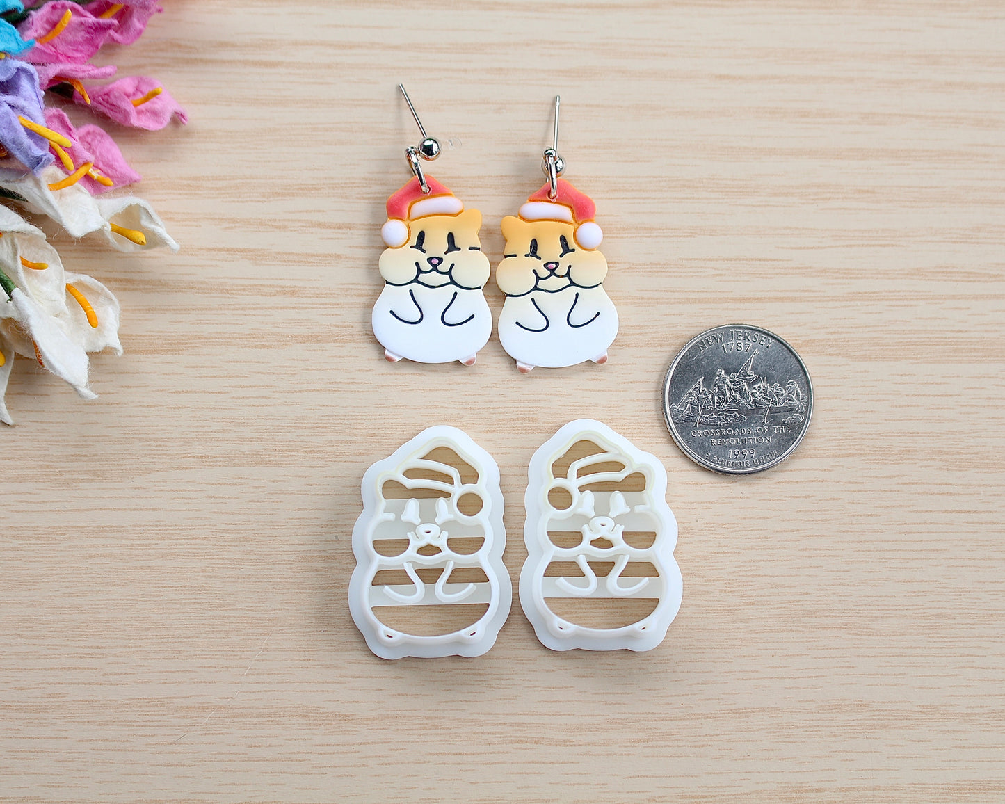 Christmas Hamster Polymer Clay Cutter shaped like a hamster wearing a Santa hat, designed for making polymer clay ornaments and crafts.