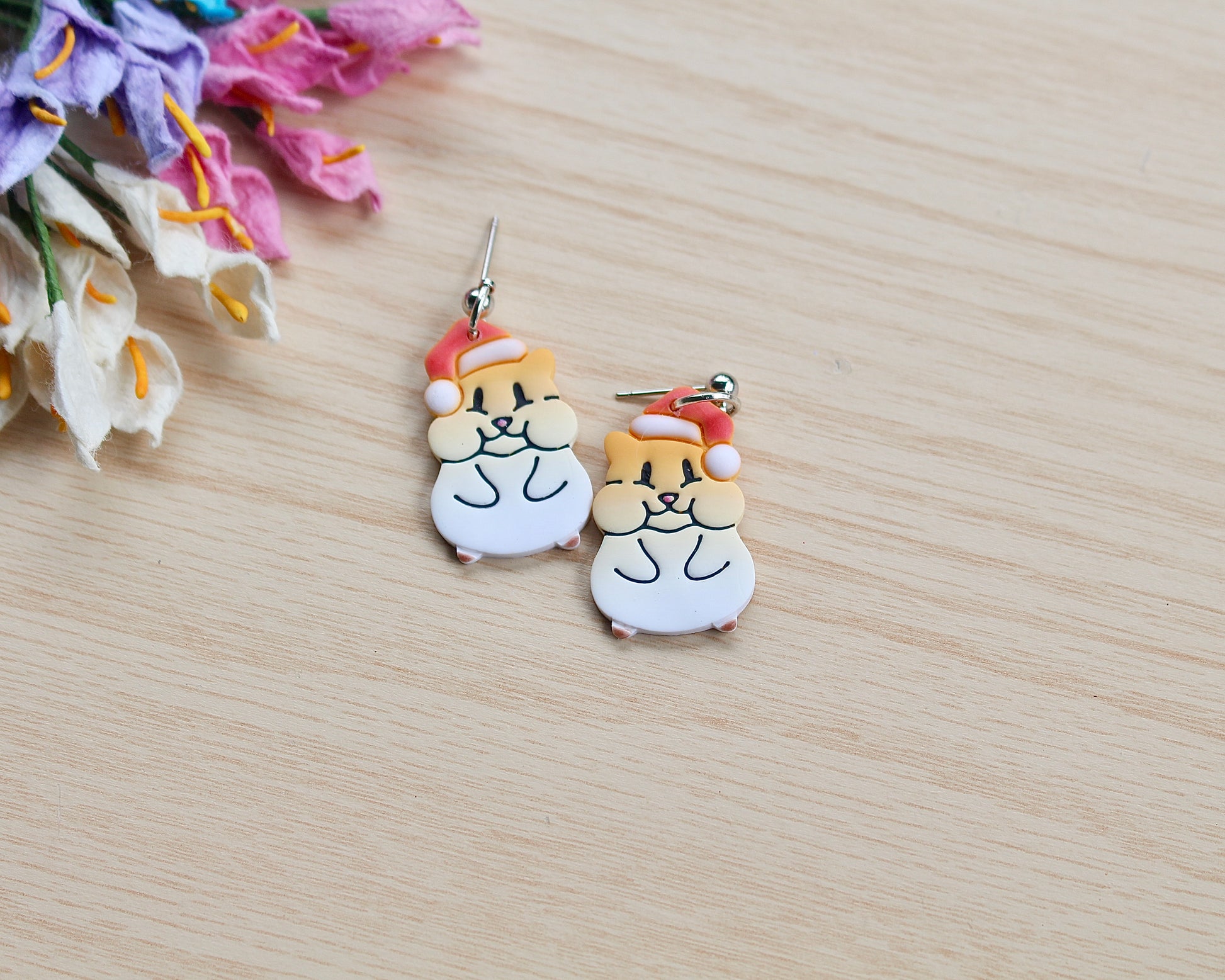 Christmas Hamster Polymer Clay Cutter shaped like a hamster wearing a Santa hat, designed for making polymer clay ornaments and crafts.