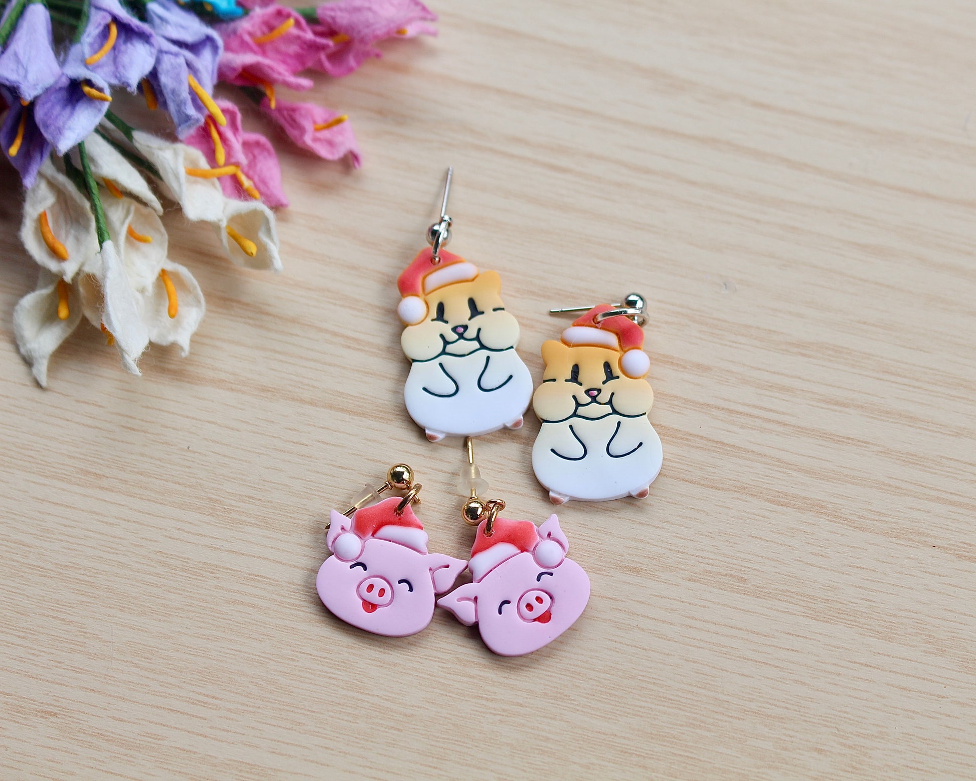 Christmas Hamster Polymer Clay Cutter shaped like a hamster wearing a Santa hat, designed for making polymer clay ornaments and crafts.