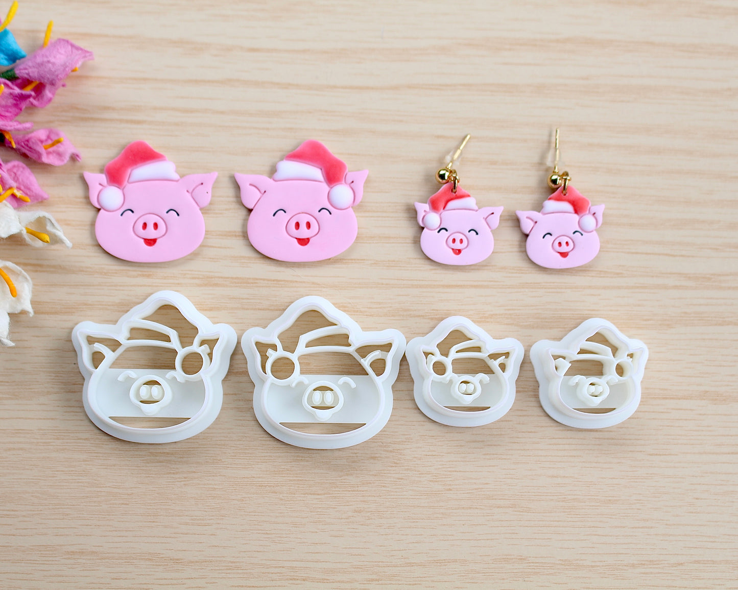 Christmas Piggy Polymer Clay Cutter shaped like a pig wearing a Santa hat, designed for making polymer clay ornaments and crafts