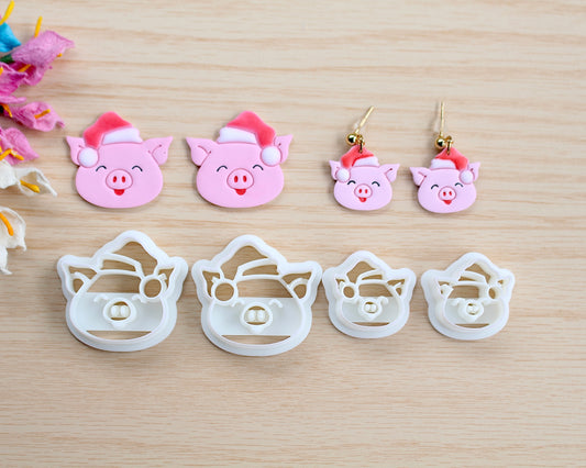 Christmas Piggy Polymer Clay Cutter shaped like a pig wearing a Santa hat, designed for making polymer clay ornaments and crafts