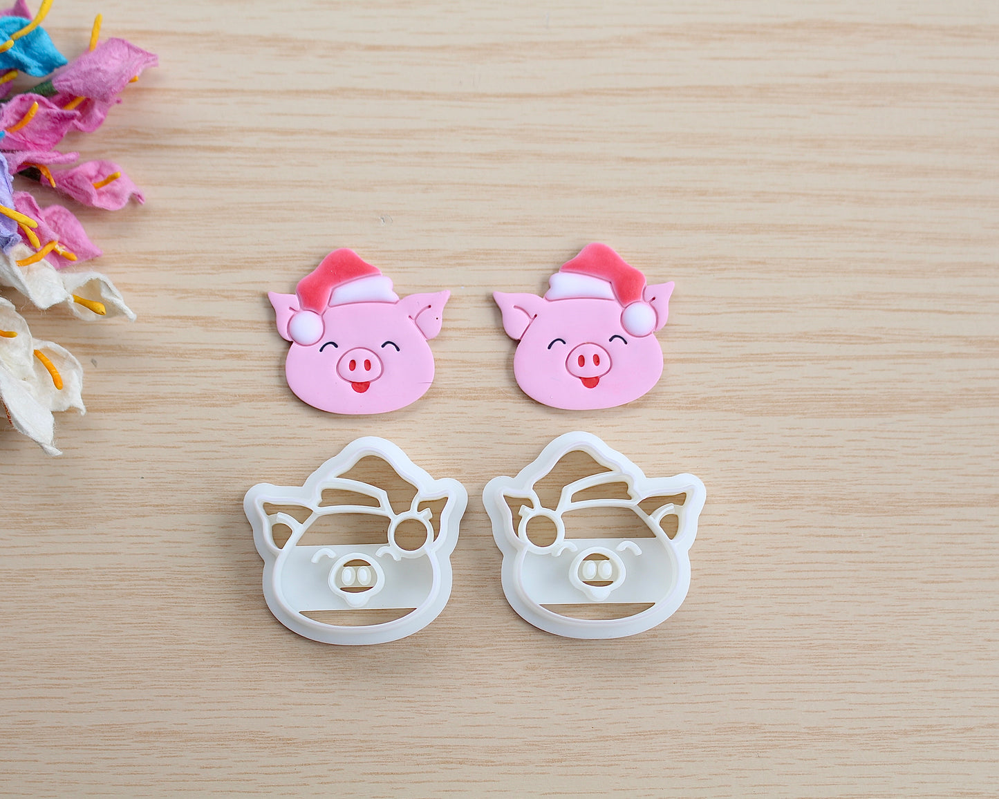 Christmas Piggy Polymer Clay Cutter shaped like a pig wearing a Santa hat, designed for making polymer clay ornaments and crafts