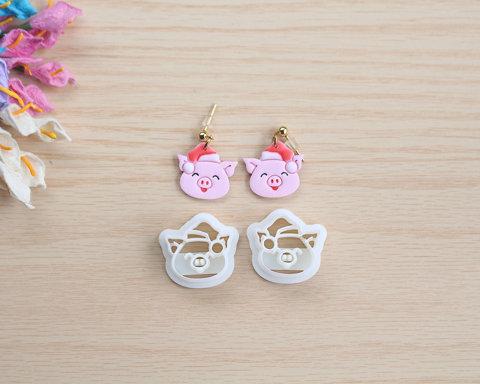 Christmas Piggy Polymer Clay Cutter shaped like a pig wearing a Santa hat, designed for making polymer clay ornaments and crafts