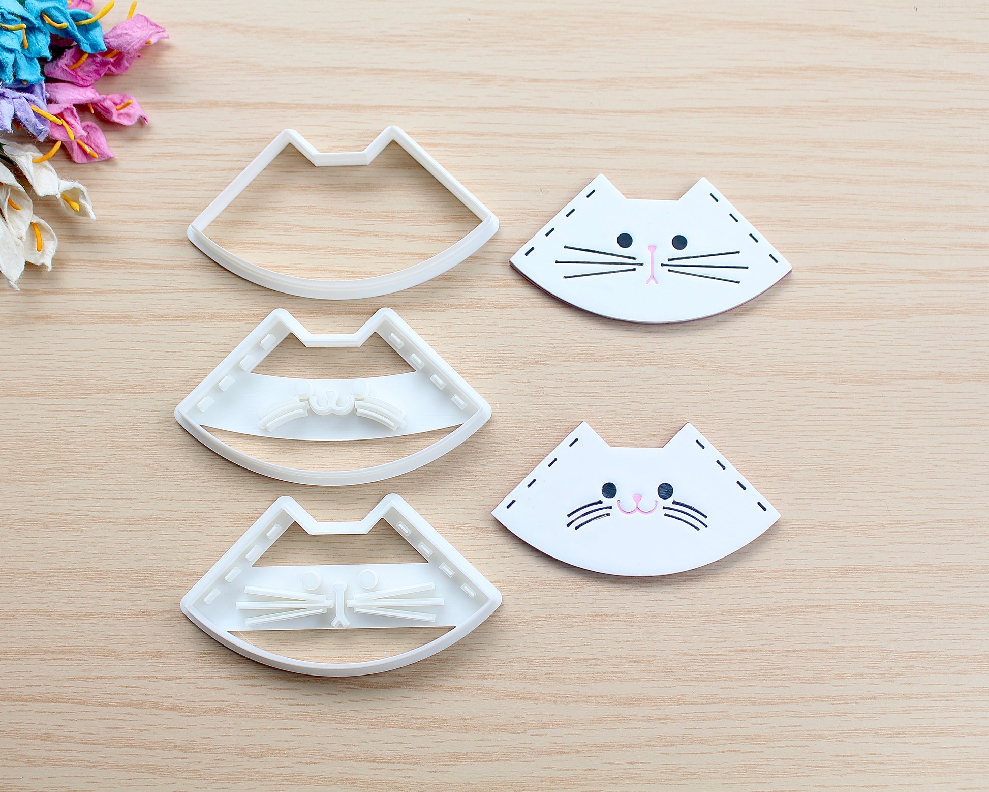 Kitty Corner Bookmark Polymer Clay Cutter in the shape of a cat’s face, designed for making polymer clay bookmarks.