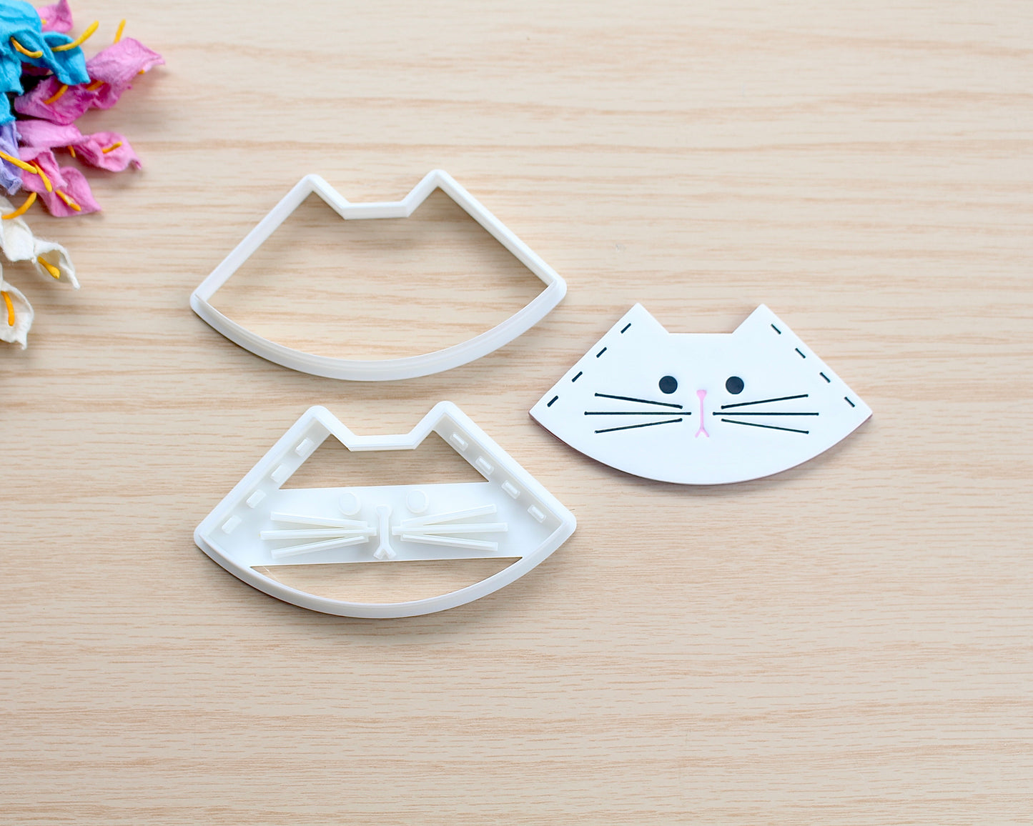 Kitty Corner Bookmark Polymer Clay Cutter in the shape of a cat’s face, designed for making polymer clay bookmarks.